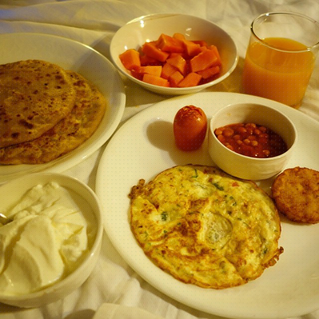The people from the restaurant, Zaffran, in Hotel Palace Heights delivered us this breakfast to our room at 5:30am on the day of our trip to Agra. It was amazing of course.  Not a fan of the beans ever, but everything else was delicious. Masala omelet, papaya, mango juice, aloo paratha. Yum.