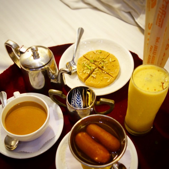 Dessert and masala tea in the room at Hotel Palace Heights in New Delhi.