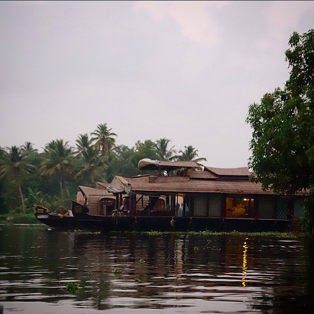 This is a view of our houseboat from the canoe ride we took into the sunset. The front left is where we had our meals and hung out, above that on the top of the boat is a covered deck we could relax and lay out on, and on the right you can see our bedroom with the shade drawn. This was such a cool experience. Alleppey Backwaters, Kerala, South India. Lakes & Lagoons Devas Indulge. Thankfully I had sea bands on me :) because I needed them!