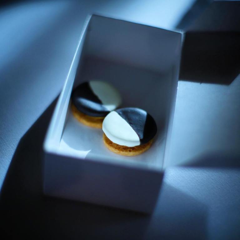 Eleven Madison Park - Birthday dinner - Started our meal with these neatly wrapped in this box tied with bakers string. Savory black and whites.  Cracker coated in cheddar, then filled with cheddar cream with a center of apple chutney - this pic is stolen from Luis’s camera :)