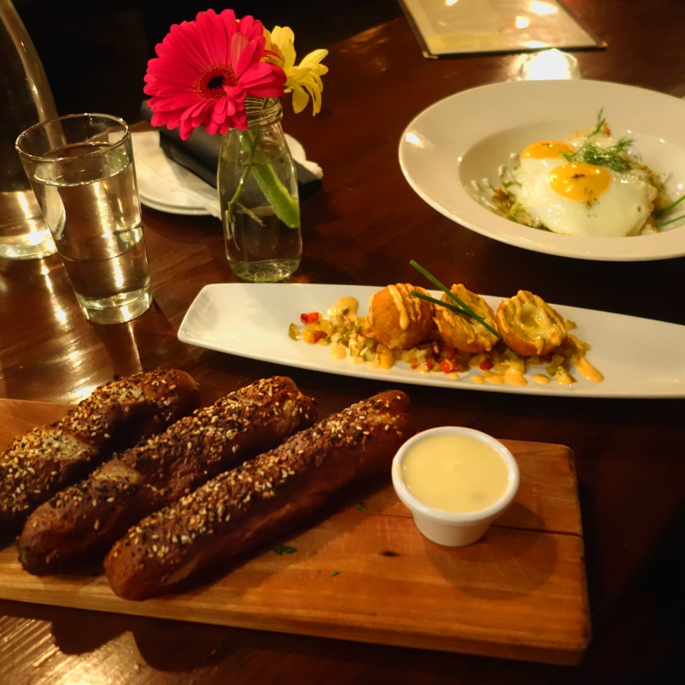 Tanner Smiths – Midtown NYC Front to back - Everything pretzel sticks with IPA cheese dip and mustard dip Brussels sprout hash with fried eggs and dill crème fraiche. Yardbird Scotch eggs with cherry pepper relish and aioli