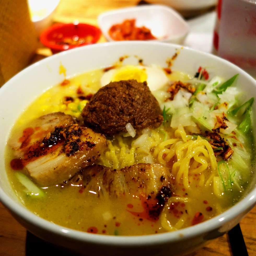 Totto Ramen - Midtown 52nd Street NYC - Extra spicy miso paitan topped with pork char siu and corn added for the win (comes with bean sprouts but I am not a fan of them in soup so I always ask for no bean sprouts!) This is topped with the finest Koji Miso and ground pork. Nomnom