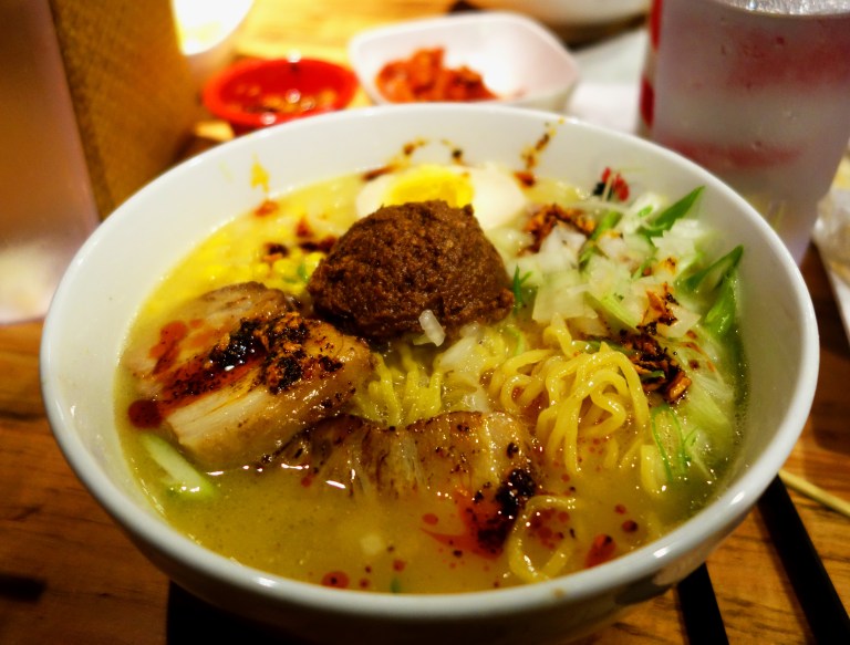 Totto Ramen - Midtown 52nd Street NYC - Extra spicy miso paitan topped with pork char siu and corn added for the win (comes with bean sprouts but I am not a fan of them in soup so I always ask for no bean sprouts!) This is topped with the finest Koji Miso and ground pork. Nomnom