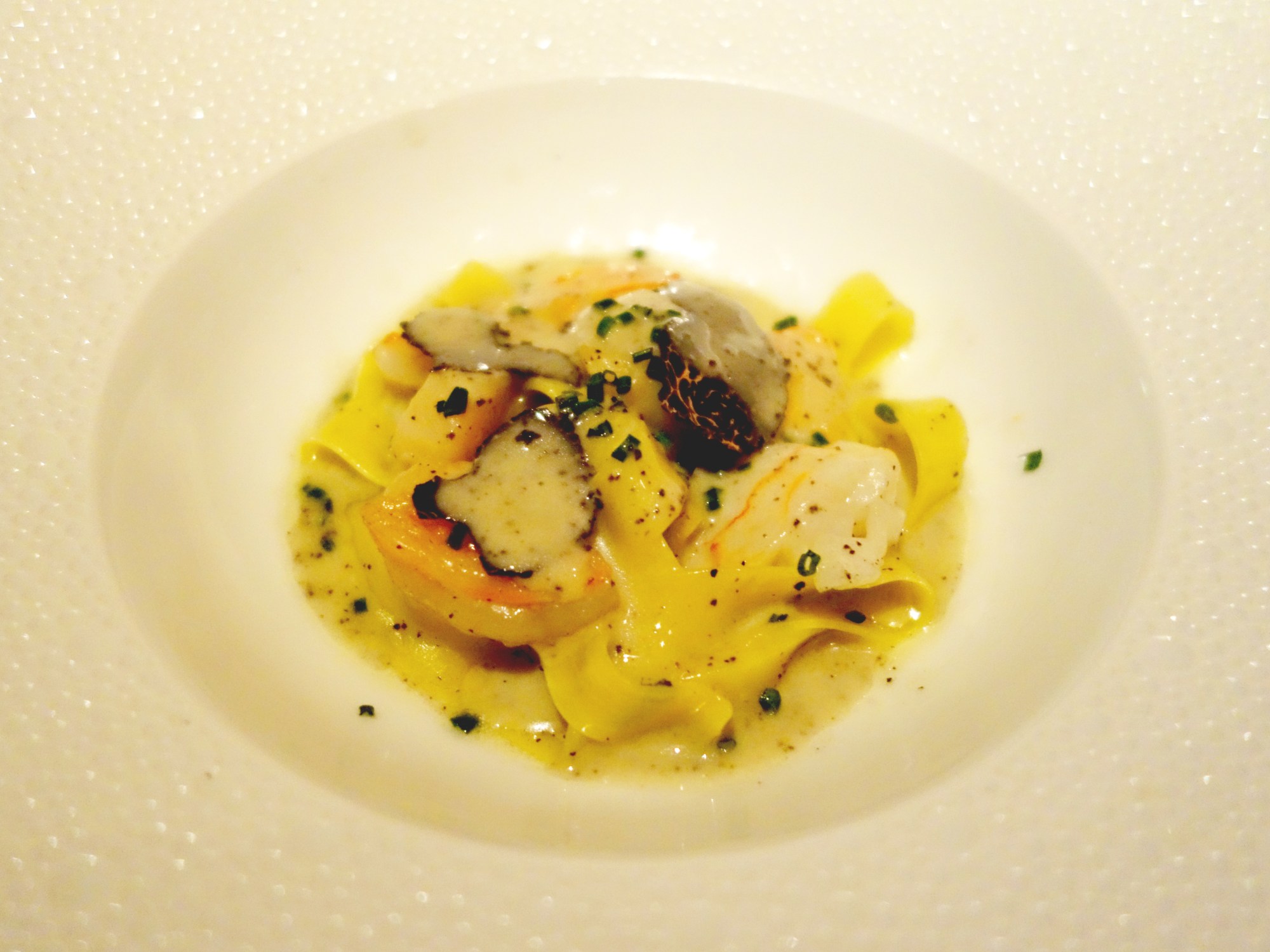 Le Bernardin Tasting Menu – Seafood Truffle Pasta - Crab, Scallop, Lobster; Tagliatelle, Black Truffle Emulsion