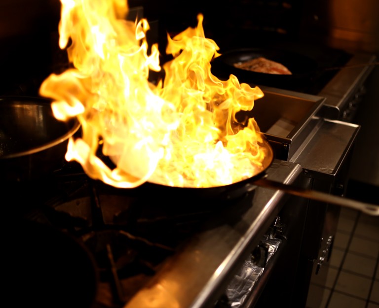 After sautéing the fennel with garlic rum is added to the pan, and set on fire to burn off the alcohol. There was no white wine in the house today, but that is what they suggested for this.