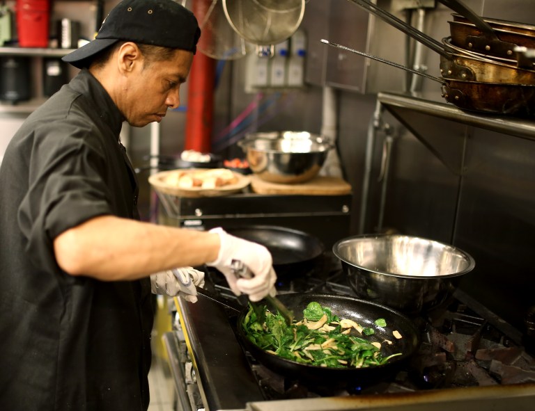 Chef Juan cooking down the filling to perfection, seasoning with kosher salt at the last minute.