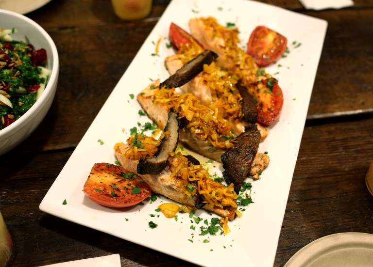 Grilled the baked salmon topped with sautéed leeks, portobello mushroom and roma tomato