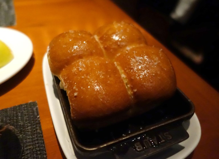 Freshly baked rolls topped with large sea salt crystals. These were the best I have had. No need for butter at all.