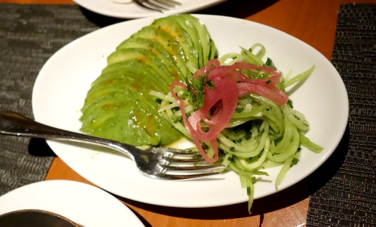 Avocado topped with sea salt and a touch of tabasco aside cucumber ribbons garnished with chives and pickled red onions. Delicious!! I normally hate tabasco but this was just the perfect amount.