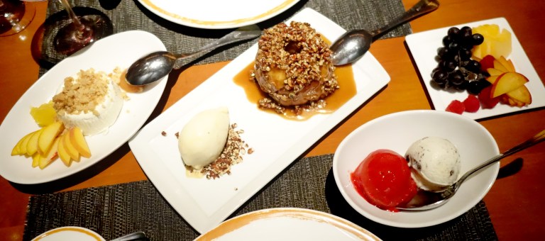 Aerial view of the dessert selection. From left to right – Panna cotta topped with some sort of crumble, a lemon compote, an apricot jam and fresh peaches, cinnamon monkey bread (cinnamon brioche, pecan toffee sauce and cinnamon ice cream), raspberry sorbet, cookies and cream ice cream and a plate of delicious fresh fruit. The raspberries in Vegas were amazing for some reason.