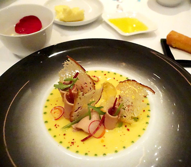 Joël Robuchon – by Joël Robuchon, Las Vegas – Le Maïs – Delicate corn cream with foie gras and Iberico de bellota ham. My app was amazing. This is served with a fried polenta stick and you are encouraged to eat this with your hands, so they give you a small dish of rose water. It reminded me of India where they would give you those with each meal.
